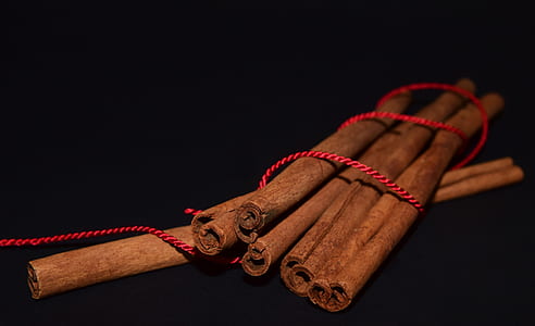 brown wooden sticks on black surface thumbnail