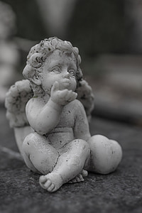 cherib ceramic figurine in macro photography thumbnail