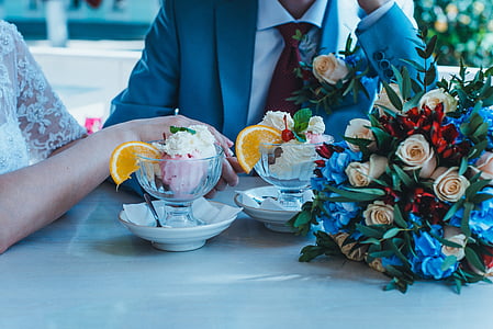 man and woman sitting beside table thumbnail