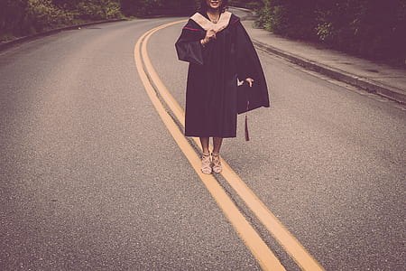 woman wearing academy dress standing on road thumbnail