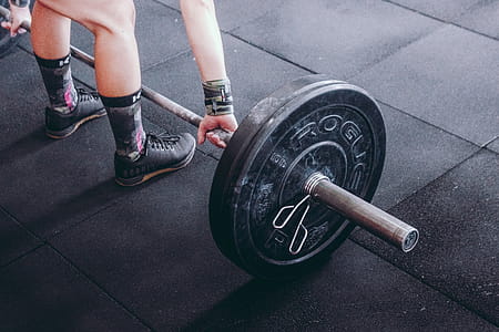 Person Holding Black and Gray Barbell thumbnail