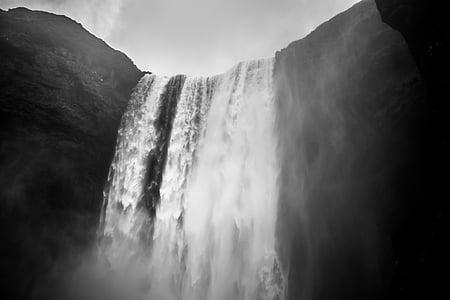 grayscale low-angle photography of waterfall thumbnail