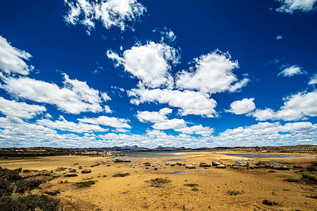 body of water under cloudy day thumbnail