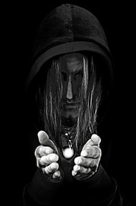 character wearing black hooded jacket with black background thumbnail