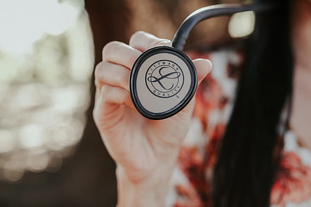 woman holding white stethoscope thumbnail
