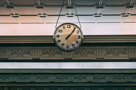 round gray hanging analog clock at 1:06 thumbnail