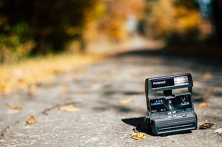 Polaroid camera on road thumbnail
