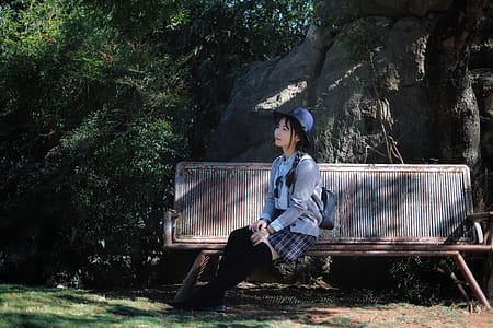 woman looking up sitting on bench thumbnail