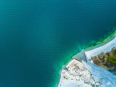 aerial photography of body of water near the land thumbnail