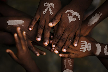 people hands with white body paint thumbnail