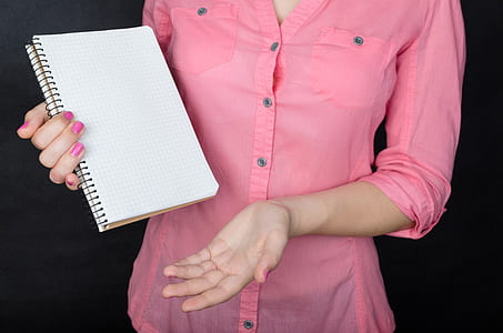 woman holding white ruled paper thumbnail