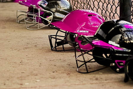 four assorted sports helmets on ground thumbnail