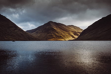 landscape photo of mountain near body of water thumbnail