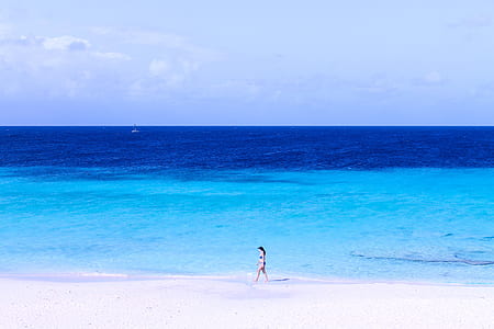 woman walking on beach thumbnail