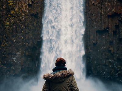 man standing in front of a waterfalls thumbnail