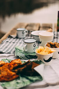 shallow focus photography of white teacup beside dishes thumbnail