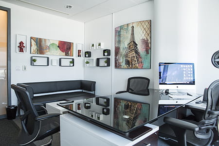silver iMac on black glass-top table thumbnail