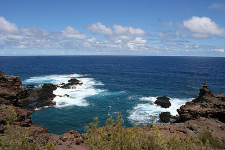 landscape photography of rocks and body of water thumbnail