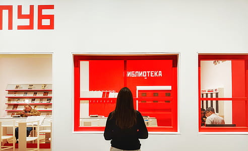 woman looking at poster thumbnail