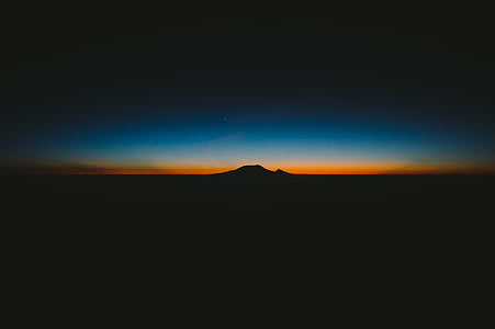 silhouette of mountain during night thumbnail
