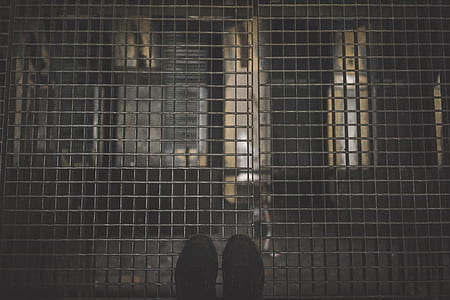person standing on steel mesh platform thumbnail