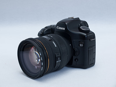 black Canon EOS 5D on white surface thumbnail