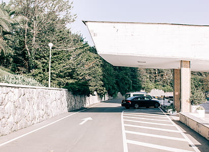 Black Car Parked on Gray Pavement thumbnail