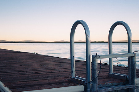 image contains gray metal bridge ladder during golden hour thumbnail