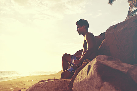 Man relaxing on the beach thumbnail
