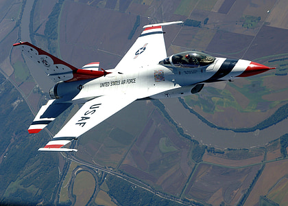 white, red, and blue plane close-up photography thumbnail