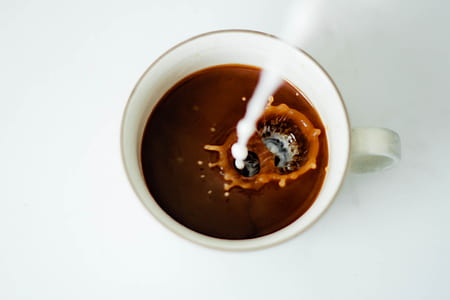 white ceramic cup with coffee thumbnail