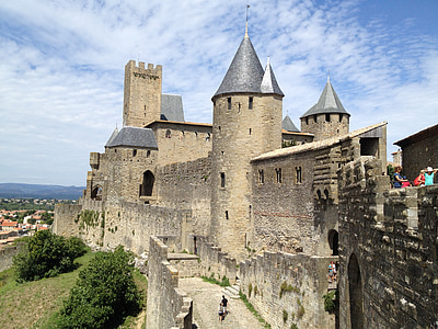 vintage castle under cloudy blue sky thumbnail