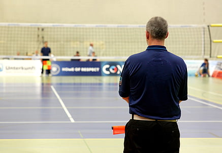 man in front of volleyball net thumbnail