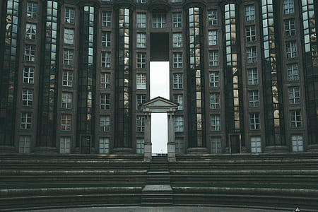 architectural photography of brown concrete building thumbnail