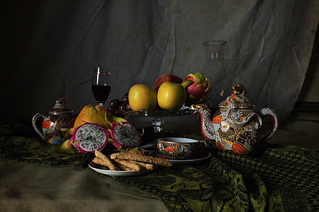 variety of fruits and teapot on brown textile thumbnail