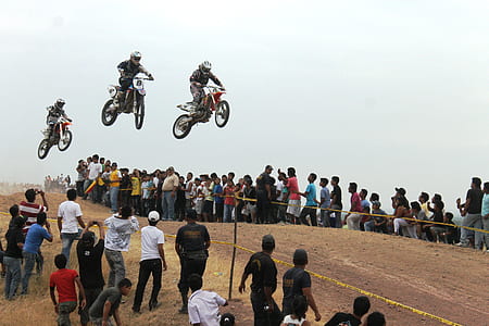 three motocross player riding motorcycles thumbnail