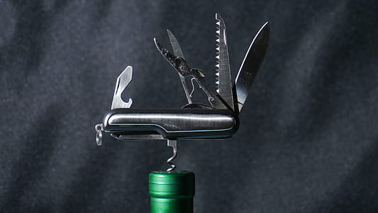 closeup photo of cork opener on liquor bottle thumbnail