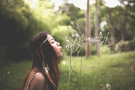 woman wearing white spaghetti strap top during daytime thumbnail