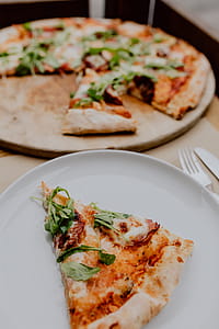 Eating delicious pizza in a cozy restaurant thumbnail