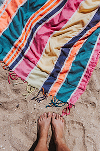 Colorful beach towel on the sand thumbnail