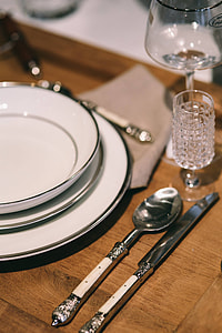 Fancy restaurant dinner table decorated with quail eggs and feathers thumbnail