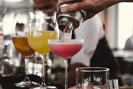 man put cocktail beverage on martini glass thumbnail