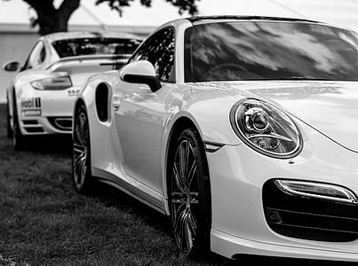 grayscale photography of two coupes thumbnail