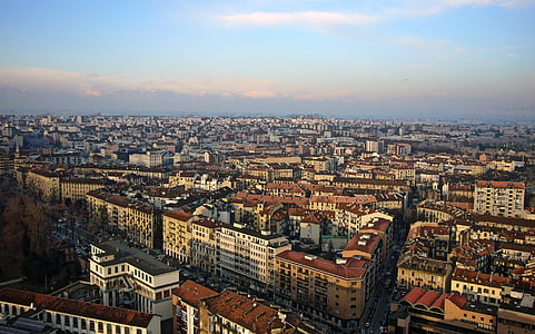 buildings under white clouds and blue sky thumbnail