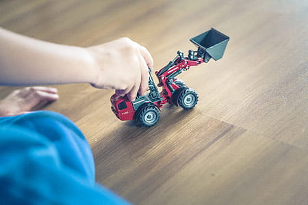 Child Playing Front Loader Toy thumbnail