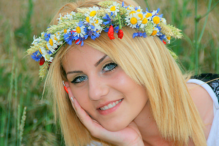 woman wearing flower crown smiling during daytime thumbnail