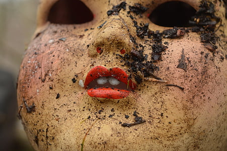 close up photography of doll with muds thumbnail