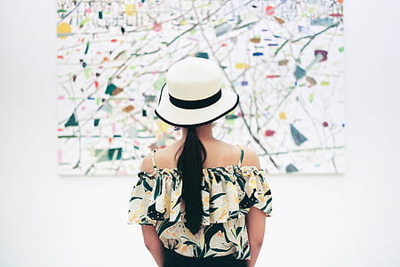 woman facing land map on wall thumbnail
