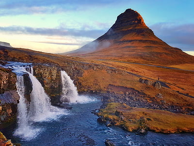 landscape photography of mountain with waterfalls thumbnail