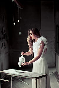 woman standing near table thumbnail